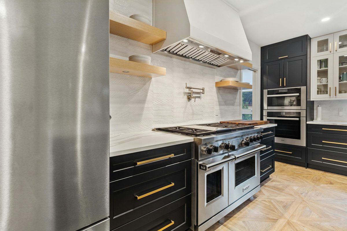 Professional-style gas range with double ovens in a residential kitchen